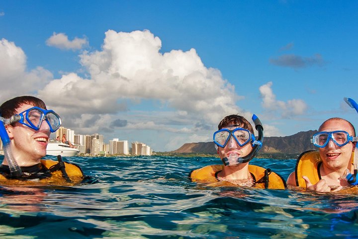 Family snorkeling together in ocean