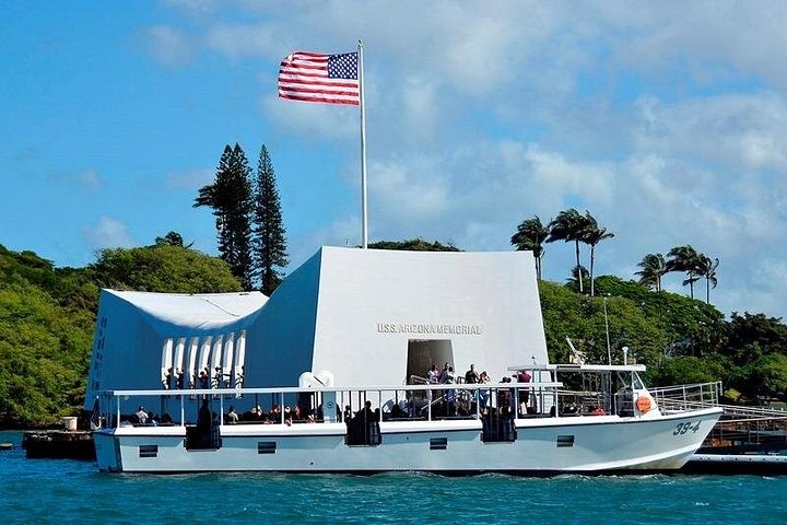 USS Arizona Memorial with a docked visitor boat