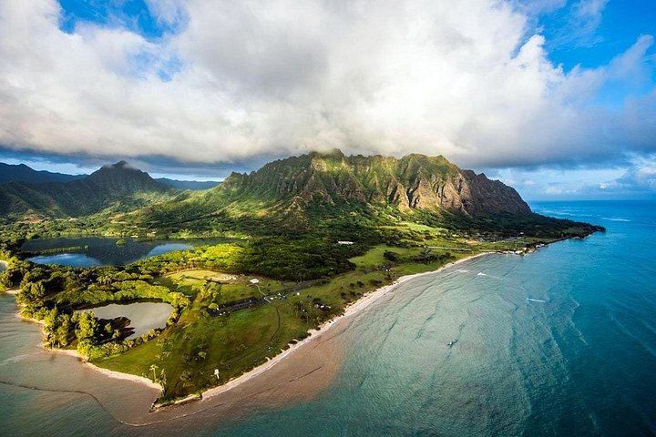 Aerial view of green coastline and turquoise water
