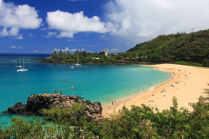 Aerial view of a sandy beach and turquoise bay