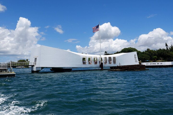 USS Arizona Memorial with an American flag